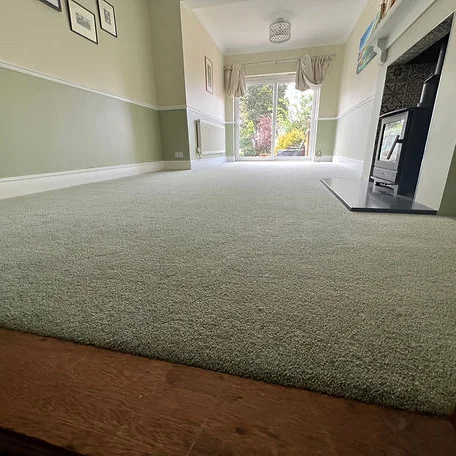 A cozy living room featuring a beautiful carpet installed by Carpet and Vinyl in the Cotswolds and Southwest