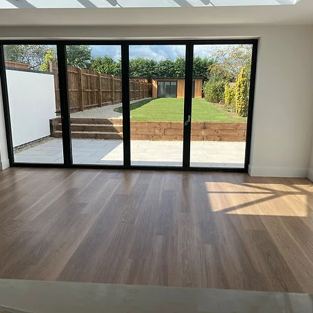 A room with a big window featuring flooring installed by Carpet and Vinyl in the Cotswolds and Southwest
