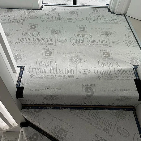 A hallway and stairs featuring underfloor installed by Carpet and Vinyl in the Cotswolds and Southwest